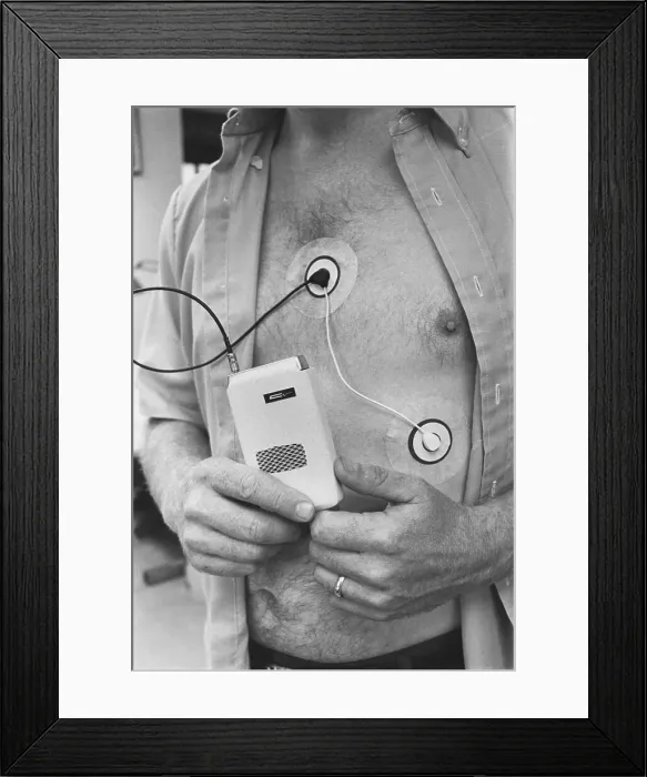 Framed Print : Man Attached and Holding to Medical Device Framed Print : Man Attached and Holding to Medical Device