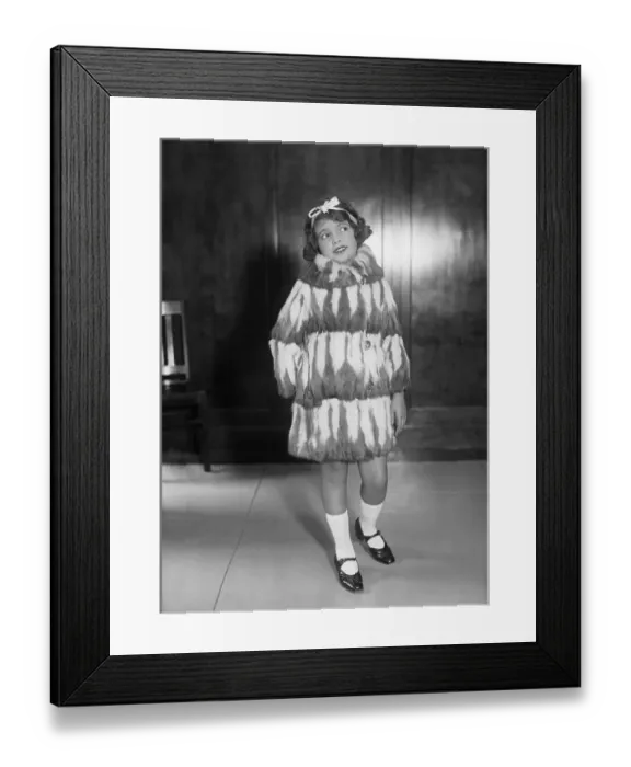 Framed Print : Young girl (10-12 years) posing in fur coat