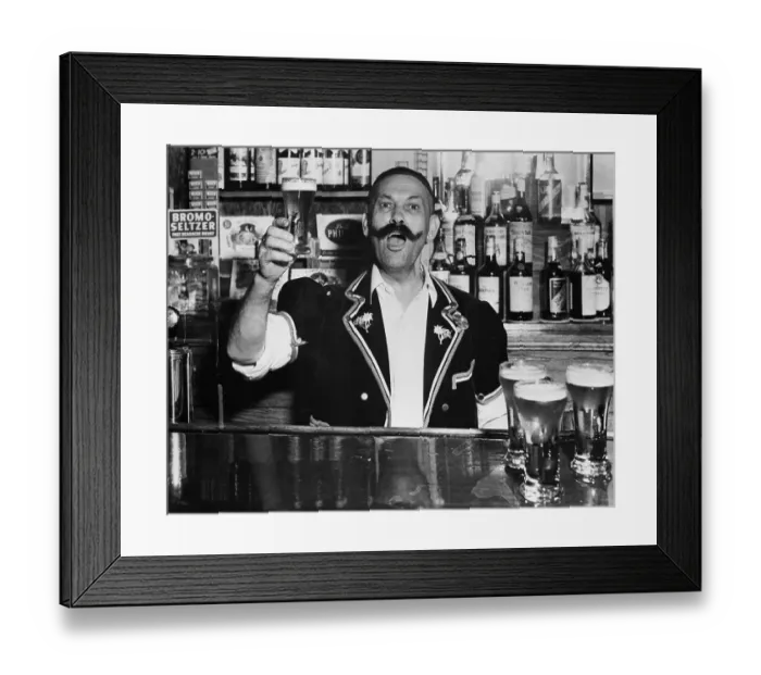 Framed Print : Vintage photograph of man working behind bar Framed Print : Vintage photograph of man working behind bar