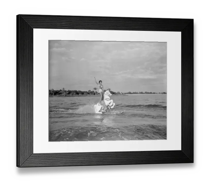 Framed Print : Skilled Female Water Skier Performing on the Water Framed Print : Skilled Female Water Skier Performing on the Water