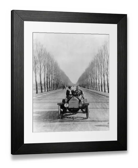 Framed Print : Young Couple Driving an Open Car Framed Print : Young Couple Driving an Open Car
