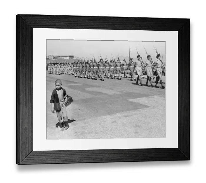 Framed Print : Young Shoe Shiner Following Marching Troops Framed Print : Young Shoe Shiner Following Marching Troops