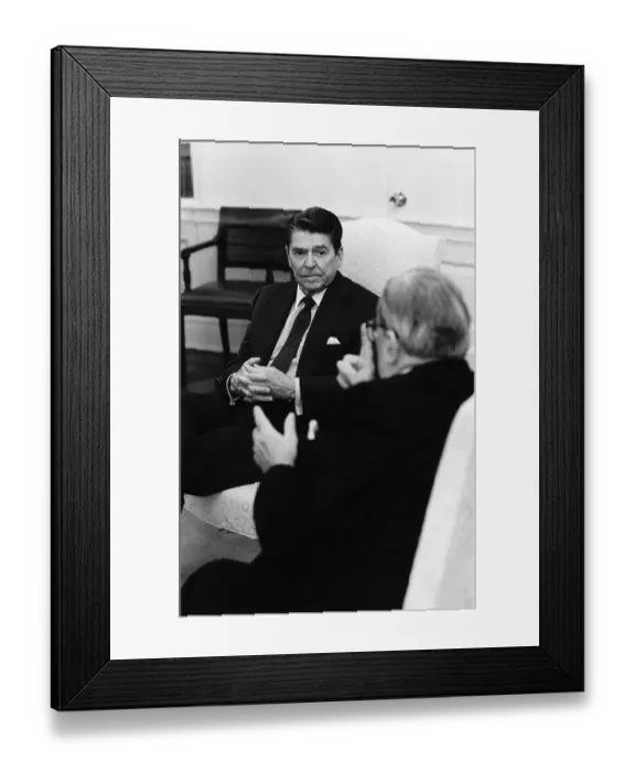 Framed Print : Ronald Reagan in Chair Listens to a Man Framed Print : Ronald Reagan in Chair Listens to a Man