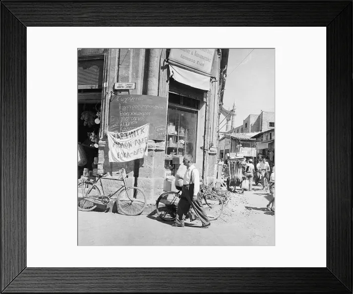 Framed Print : Sign Hanging On The Front Of A Store Framed Print : Sign Hanging On The Front Of A Store