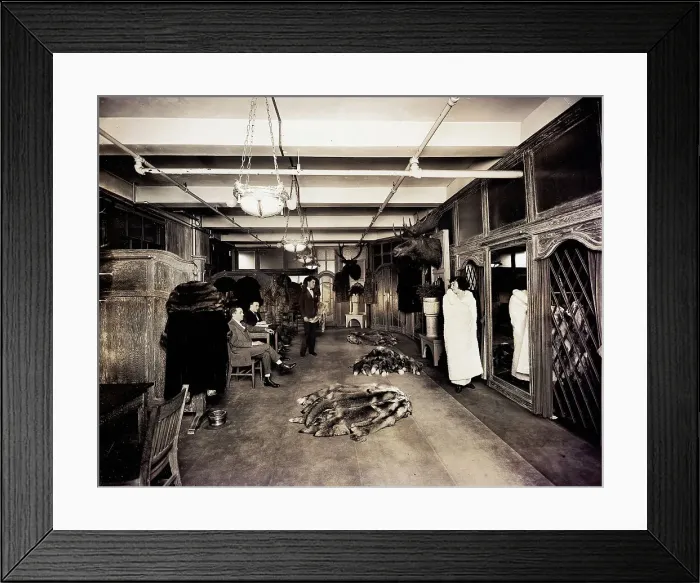 Framed Print : Woman Trying On White Fur Coat In Store Framed Print : Woman Trying On White Fur Coat In Store