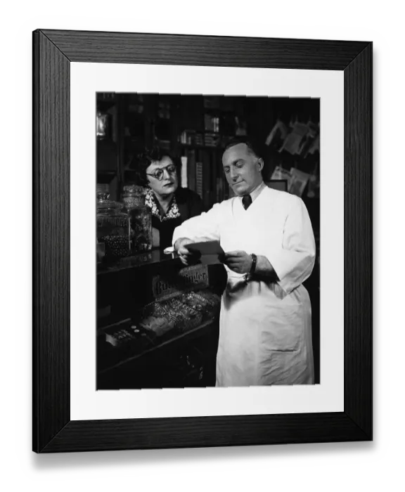 Framed Print : Grocer Reads Customer'S List @Counter Framed Print : Grocer Reads Customer'S List @Counter