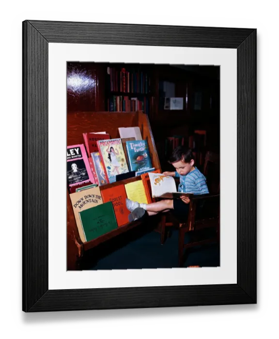 Framed Print : Child Reading at the Library Framed Print : Child Reading at the Library