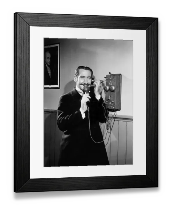 Framed Print : Man Talking On Duel-Transmitter Phone Framed Print : Man Talking On Duel-Transmitter Phone