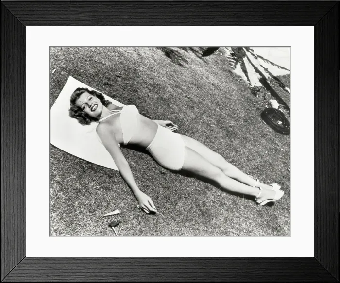 Framed Print : Actress Rita Hayworth Lying In The Sun Framed Print : Actress Rita Hayworth Lying In The Sun