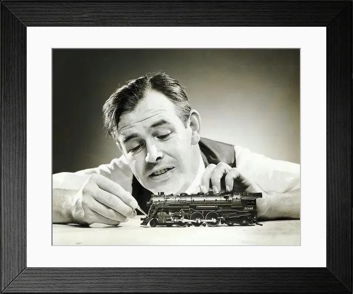 Framed Print : Man Adjusting Model Train W / Tweezer Framed Print : Man Adjusting Model Train W / Tweezer
