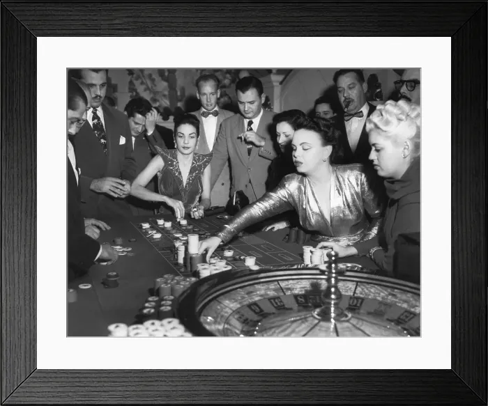 Framed Print : Woman Placing a Bet at a Roulette Wheel Framed Print : Woman Placing a Bet at a Roulette Wheel