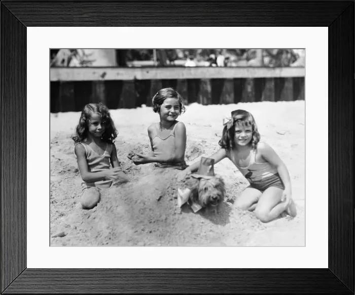 Framed Print : Three girls (4-5) playing in sand on beach Framed Print : Three girls (4-5) playing in sand on beach