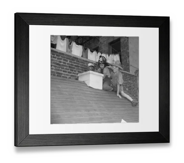 Framed Print : Boys (6-7) wearing firemen hats on roof Framed Print : Boys (6-7) wearing firemen hats on roof