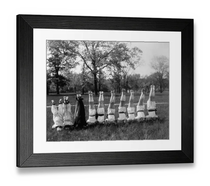 Framed Print : People in row standing on head outdoors