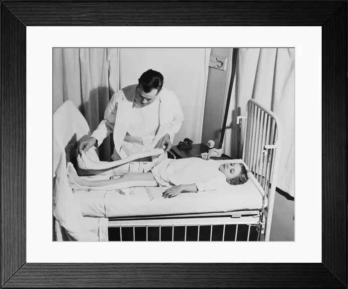 Framed Print : Doctor Examining Young Patient Framed Print : Doctor Examining Young Patient