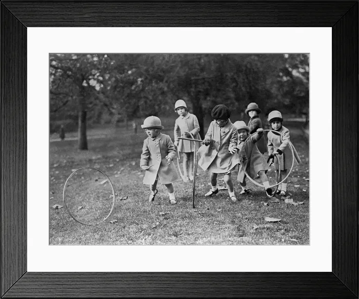 Framed Print : Children Play With Hoops In The Park Framed Print : Children Play With Hoops In The Park