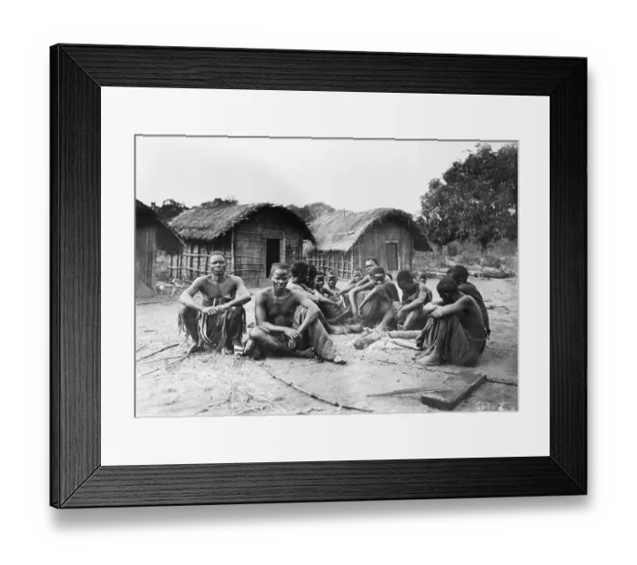 Framed Print : Villagers Sit Together in Front of Homes