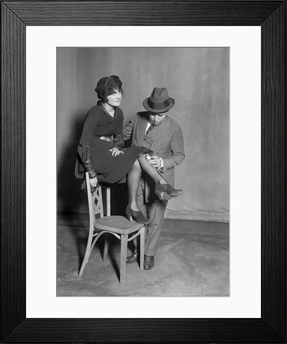 Framed Print : Man placing pedometer on females leg. Globe Theatre, New York City, New York State, USA. March 28, 1922 Framed Print : Man placing pedometer on females leg. Globe Theatre, New York City, New York State, USA. March 28, 1922