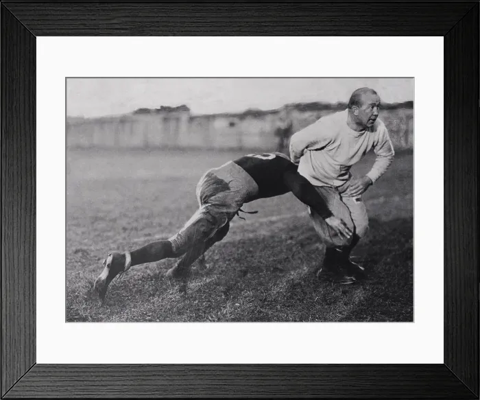 Framed Print : Coach Knute Rockne Teaching Tackling to Football Player Framed Print : Coach Knute Rockne Teaching Tackling to Football Player