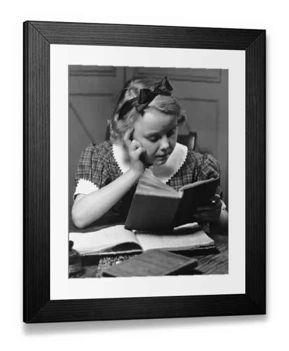 Framed Print : Young girl reading book Framed Print : Young girl reading book