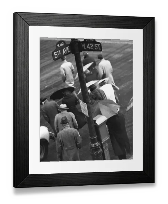 Framed Print : People in rain at corner of 5th Avenue and 42nd St Framed Print : People in rain at corner of 5th Avenue and 42nd St
