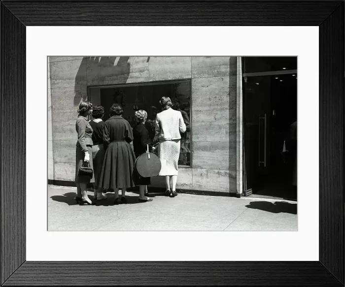 Framed Print : Women looking at window display, rear view Framed Print : Women looking at window display, rear view