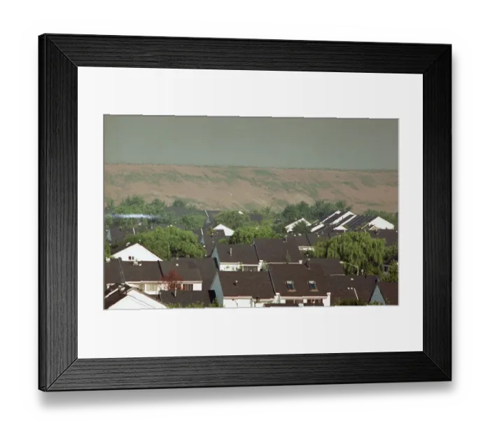 Framed Print : View Of Landfill Over Housing Developmen Framed Print : View Of Landfill Over Housing Developmen