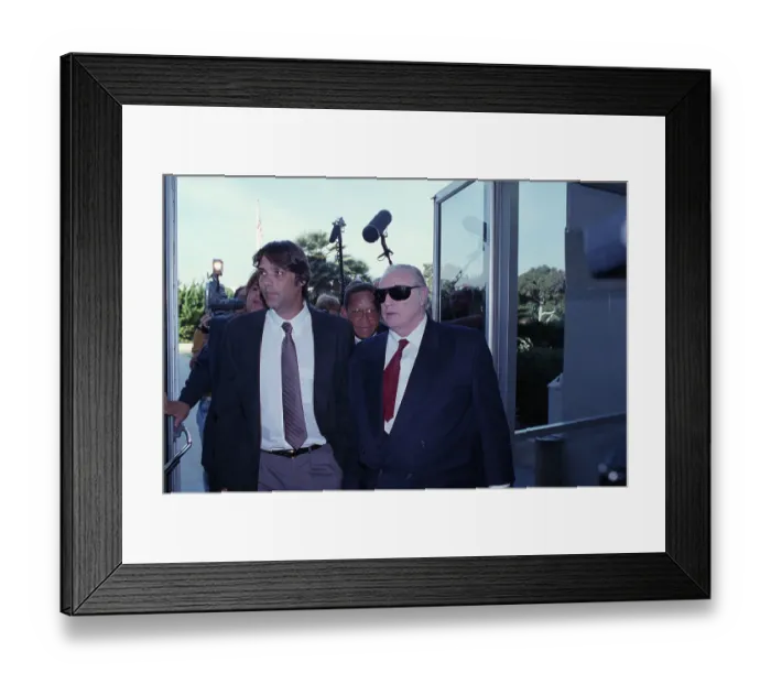 Framed Print : Christian Brando and Marlon Brando Walk with Press