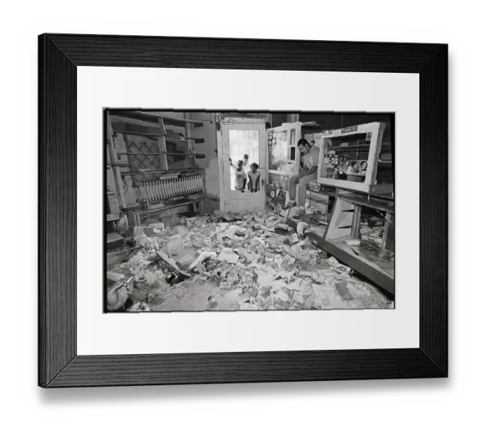 Framed Print : Man Seated in Trashed and Looted Store Framed Print : Man Seated in Trashed and Looted Store