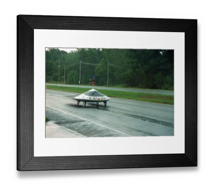 Framed Print : Solar Powered Automobile Stopping in Rain Storm Framed Print : Solar Powered Automobile Stopping in Rain Storm