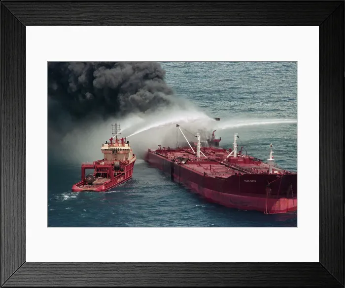 Framed Print : Boat Pours Water On Burning Oil Tanker Framed Print : Boat Pours Water On Burning Oil Tanker