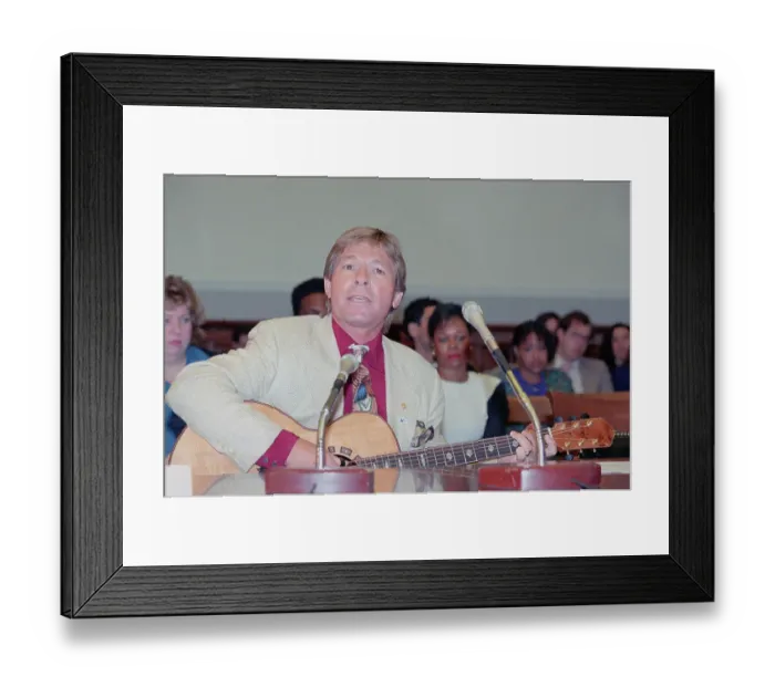Framed Print : John Denver Signing During Hearing