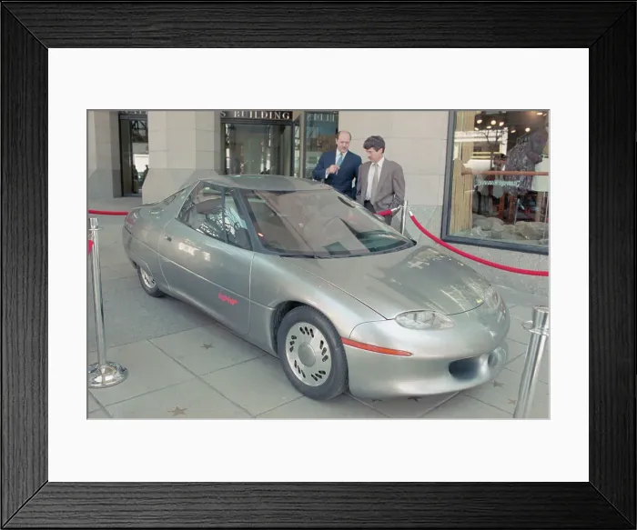 Framed Print : People Viewing the New Model Car Framed Print : People Viewing the New Model Car