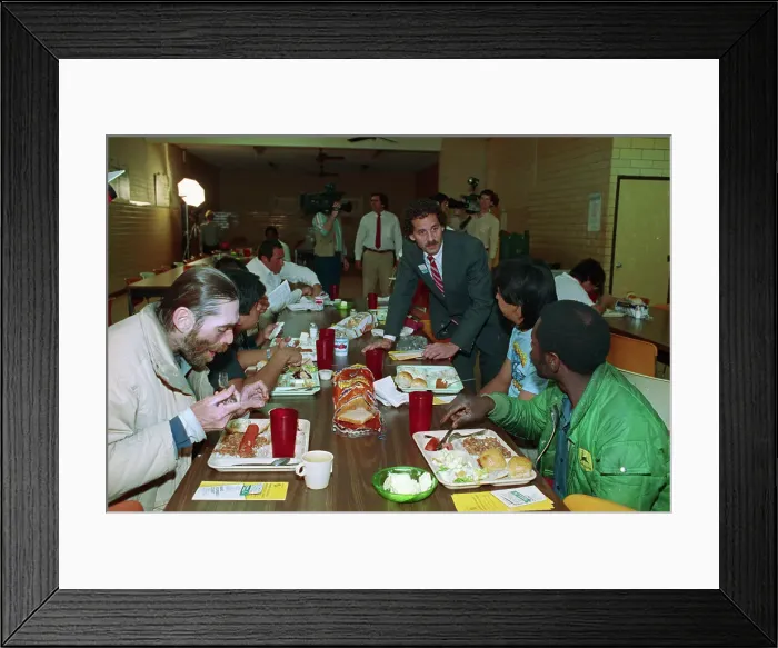 Framed Print : Homeless Shelter Manager Interviewing Men Framed Print : Homeless Shelter Manager Interviewing Men
