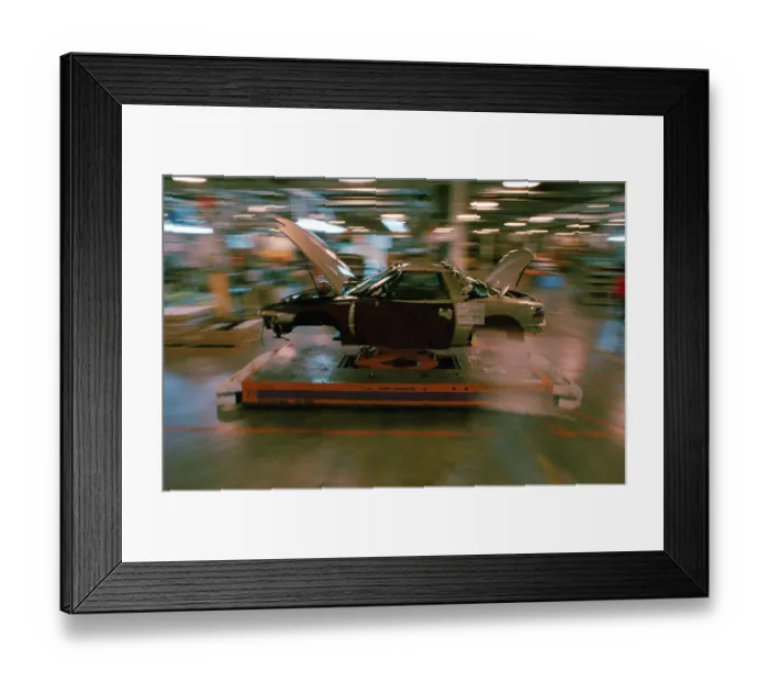 Framed Print : Partially Assembled Car Moving Through Work Station Framed Print : Partially Assembled Car Moving Through Work Station