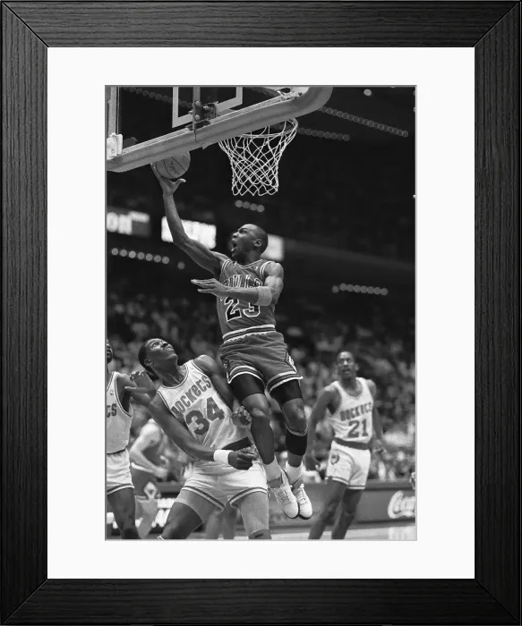 Framed Print : Michael Jordan Jumping Over Akeem Olajuwan to Score Framed Print : Michael Jordan Jumping Over Akeem Olajuwan to Score