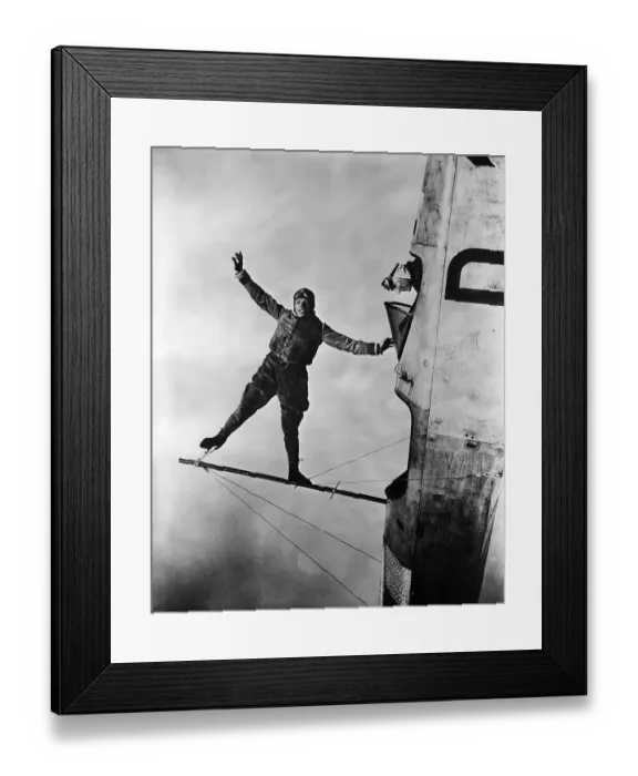 Framed Print : Stunt Flier Suspended over Cockpit Framed Print : Stunt Flier Suspended over Cockpit