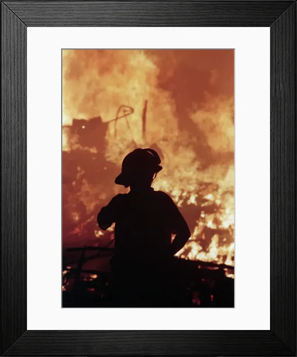 Framed Print : Silhouetted Fireman Watching Fire Framed Print : Silhouetted Fireman Watching Fire