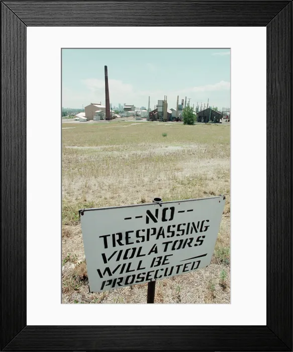 Framed Print : No Trespassing Sign In Field By Factory Framed Print : No Trespassing Sign In Field By Factory