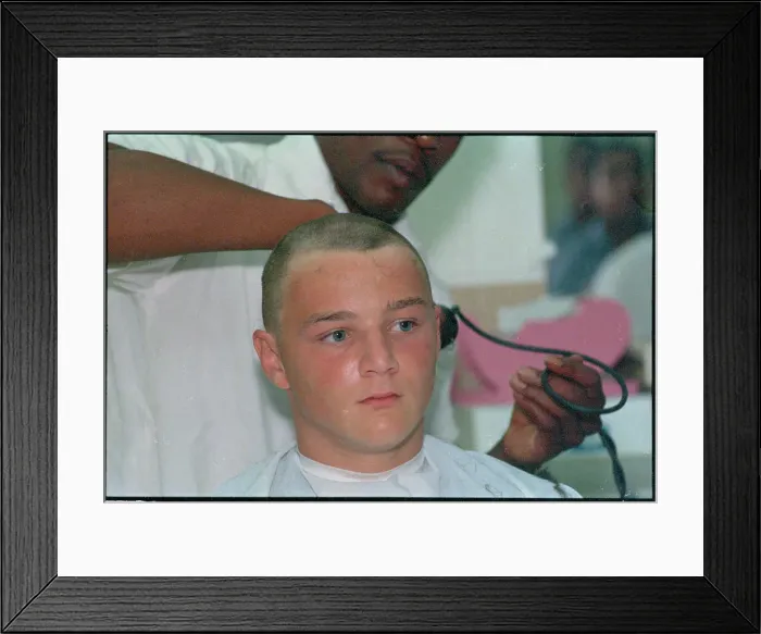 Framed Print : Young Man Getting Hair Shaved Off Framed Print : Young Man Getting Hair Shaved Off
