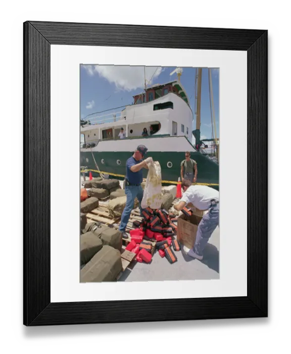 Framed Print : Customs Agents Unloading Bag of Drug Smuggling Framed Print : Customs Agents Unloading Bag of Drug Smuggling