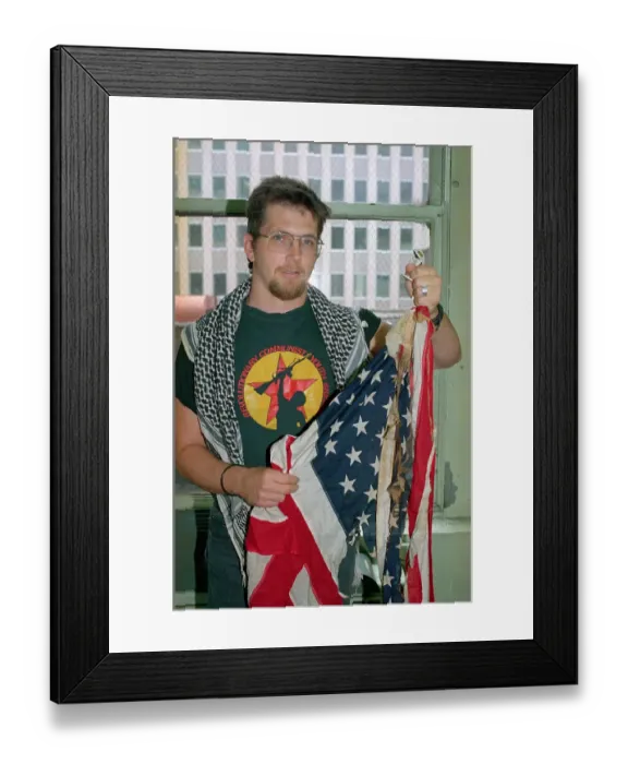 Framed Print : Man Holding Burned American Flag Framed Print : Man Holding Burned American Flag