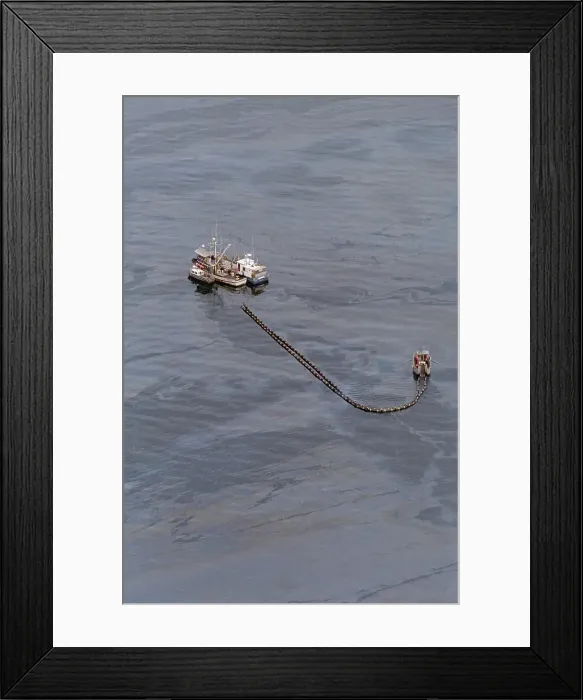 Framed Print : Boom Boat Collecting Oil From Spill Framed Print : Boom Boat Collecting Oil From Spill