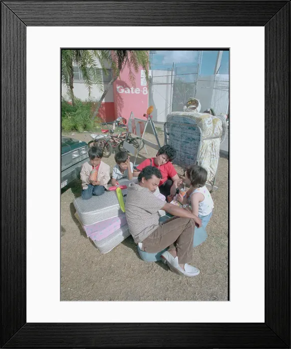 Framed Print : Martinez Family Packing their Belongings Framed Print : Martinez Family Packing their Belongings