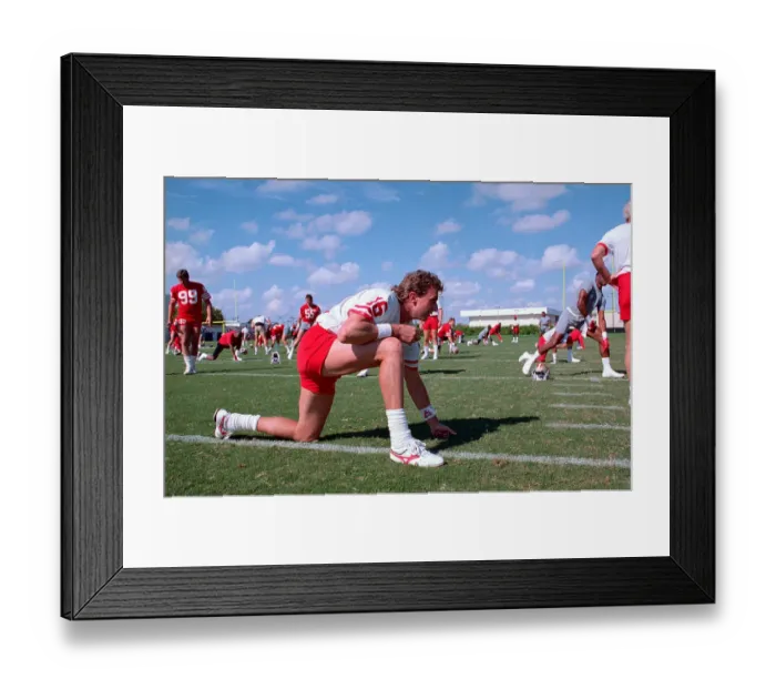 Framed Print : Quarterback Joe Montana Stretching Framed Print : Quarterback Joe Montana Stretching