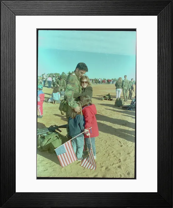 Framed Print : Family Embracing Paratrooper