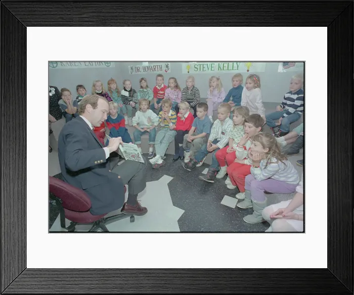 Framed Print : Neil Bush Reading to Children Framed Print : Neil Bush Reading to Children