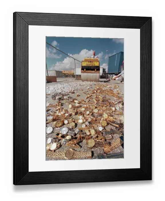 Framed Print : Steamroller Rolling Over Fake Watches Framed Print : Steamroller Rolling Over Fake Watches