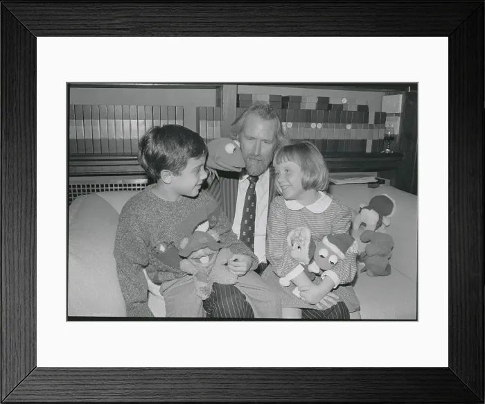 Framed Print : Jim Henson Offering Gifts to Children Framed Print : Jim Henson Offering Gifts to Children