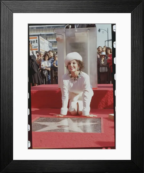 Framed Print : Joan Collins Posing with Her Star on Hollywood Boulevard Framed Print : Joan Collins Posing with Her Star on Hollywood Boulevard